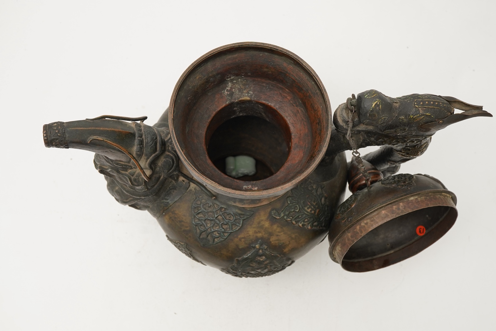 A large Tibetan repoussé brass and copper ewer, 19th century
